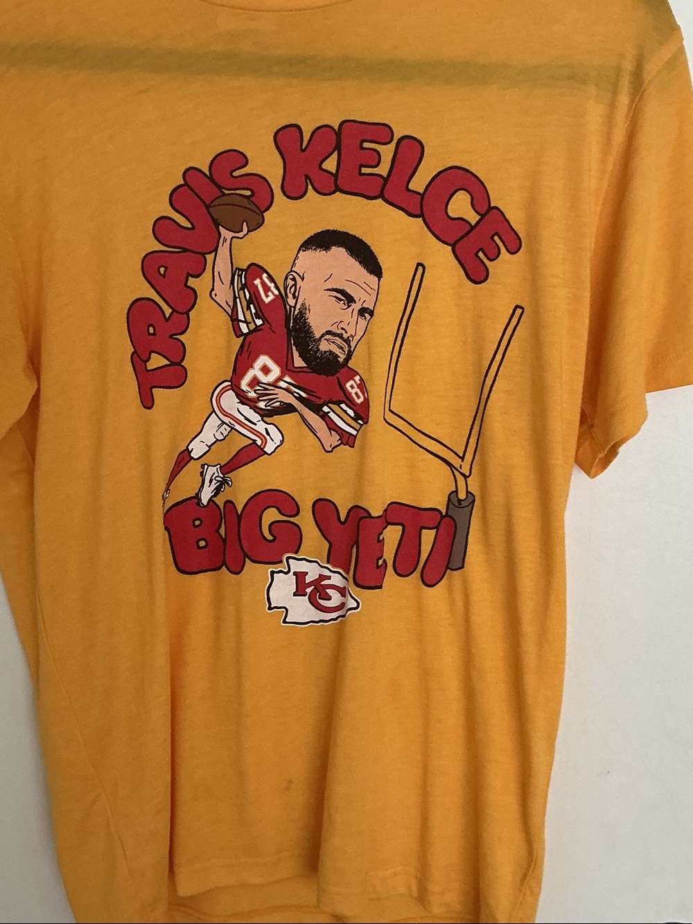 HOMAGE yellow tee with red logo tag